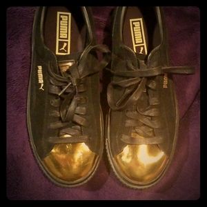 PUMA black suede and gold sneakers